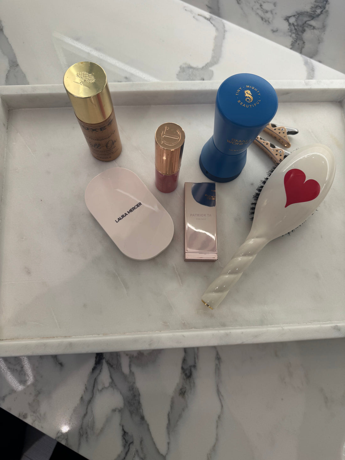 Minimal haircare tools on a neutral surface — how often to wash hair by hair type