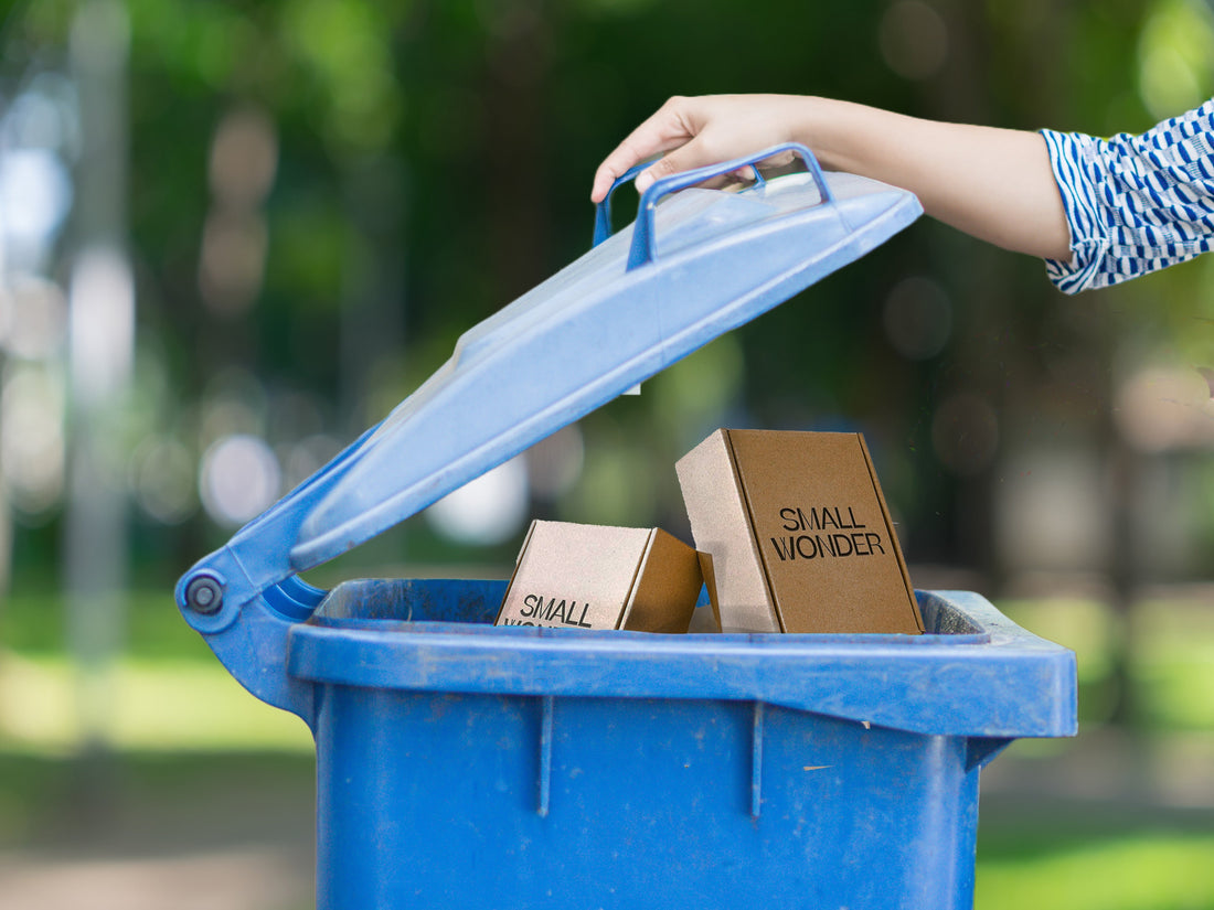 Showing Small Wonder packaging in a recycling bin