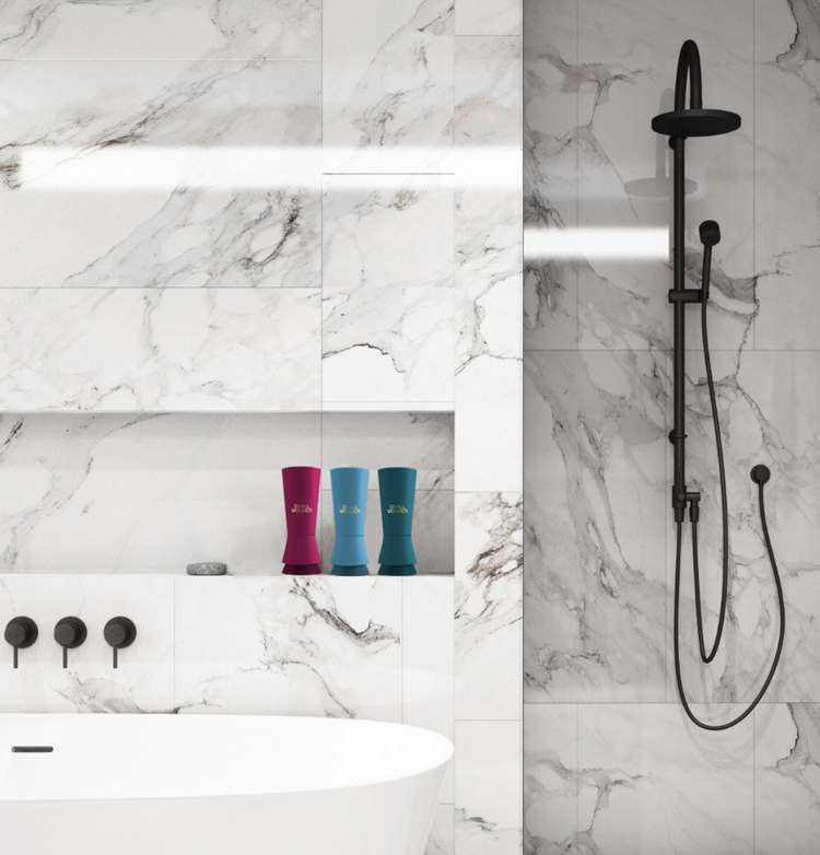 Aesthetic marble bathroom with Small Wonder products on a shelf