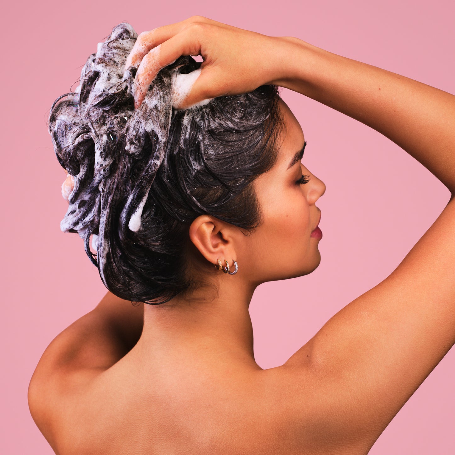 Woman lathering hair