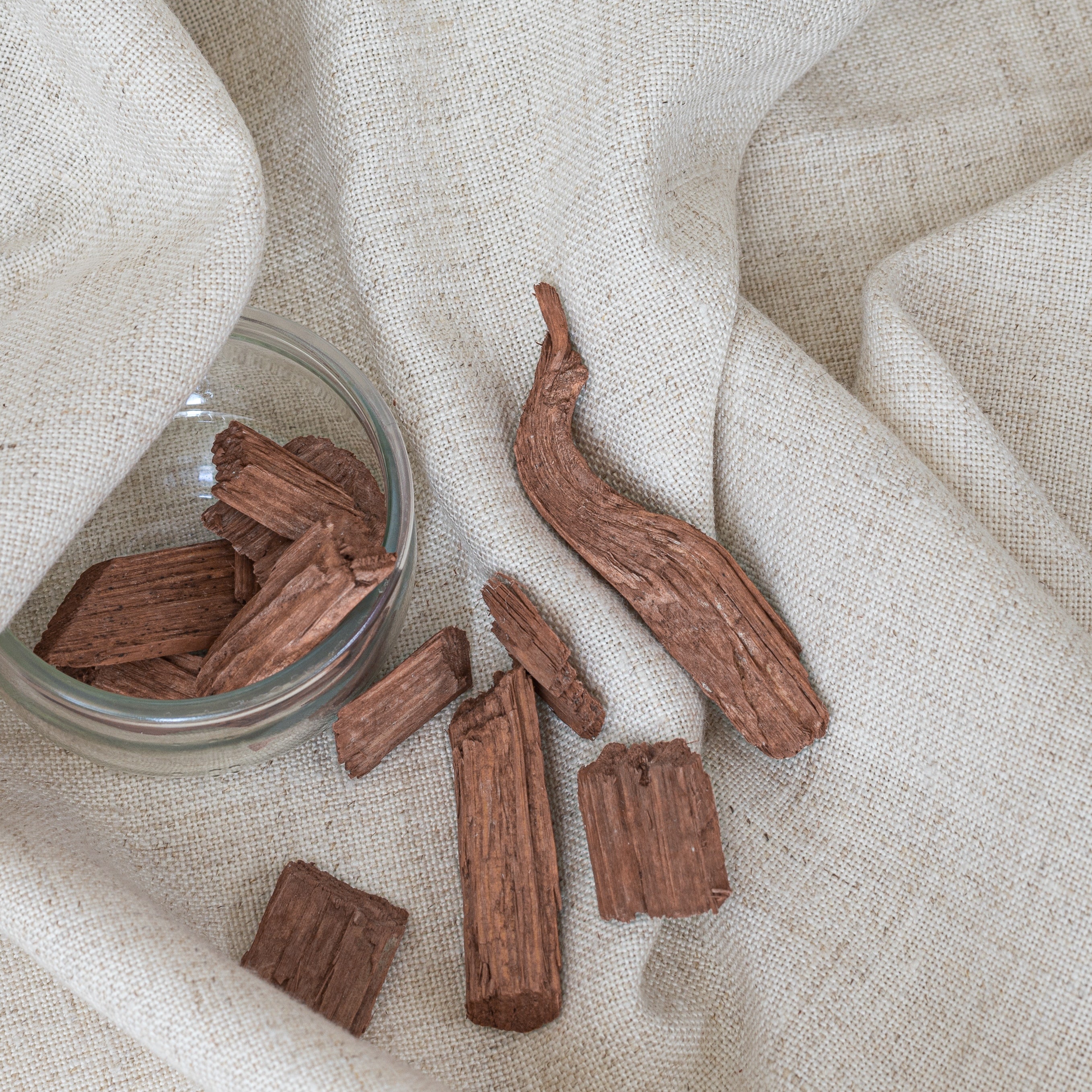 Cedar Wood and a glass bowl on linen