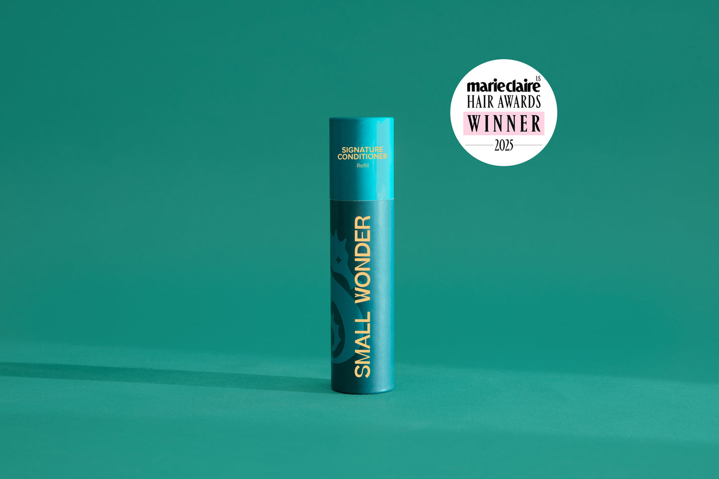 Small Wonder Signature Conditioner refill tube next to Marie Claire Har Awards 2025 Winner Label