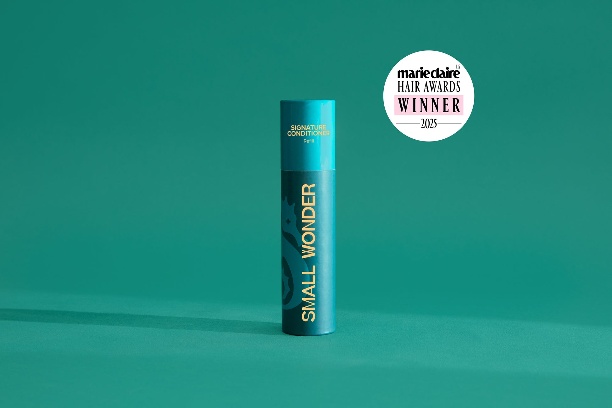 Small Wonder Signature Conditioner refill tube next to Marie Claire Har Awards 2025 Winner Label