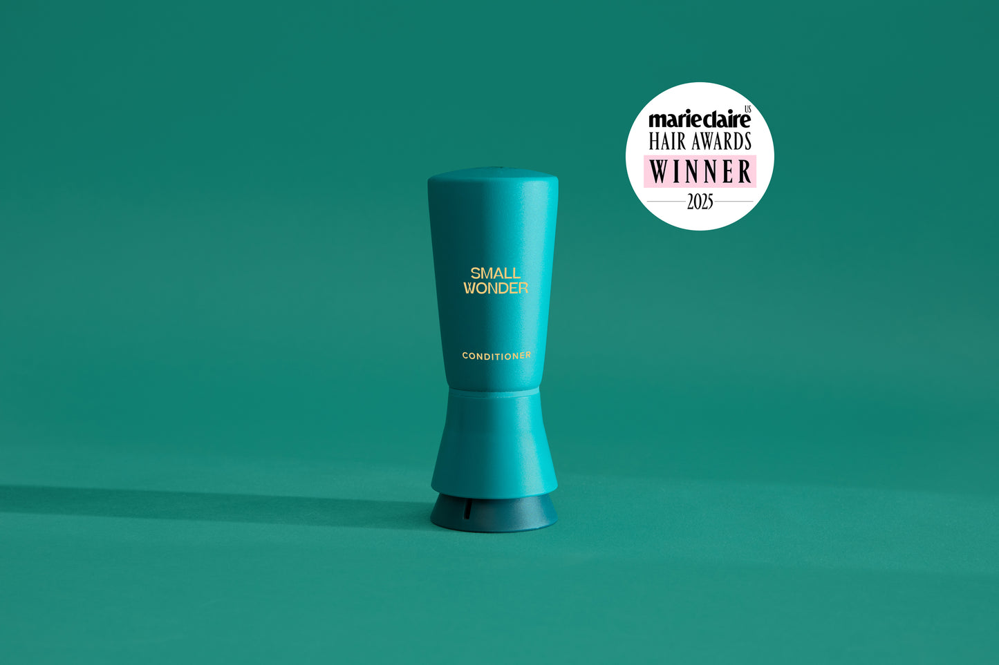 Small Wonder Signature Conditioner refill tube next to Marie Claire Har Awards 2025 Winner Label