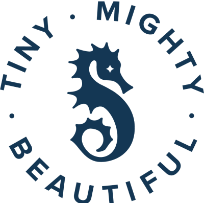 Blue Circular 'Tiny. Mighty. Beautiful.' Text with Seahorse in the middle