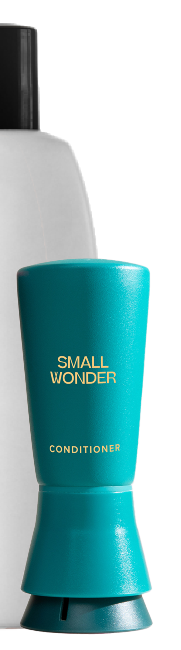 Teal Small Wonder Conditioner bottle next to large white unlabeled bottle