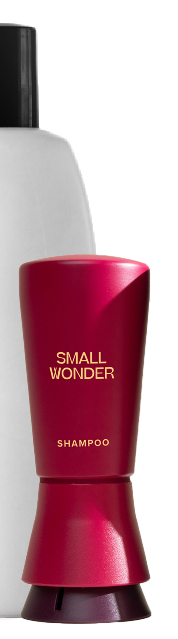 Red Small Wonder Shampoo bottle next to large white unlabeled bottle