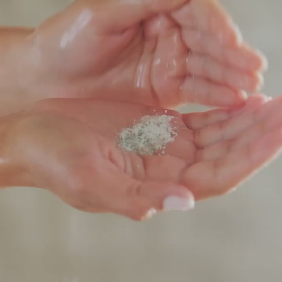 Video of hands lathering from green powder