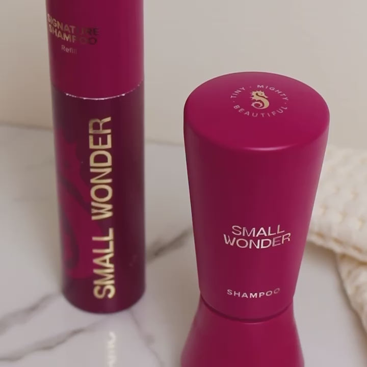 Video of hand unscrewing a Small Wonder Signature Shampoo bottle and then the matching refill bottle