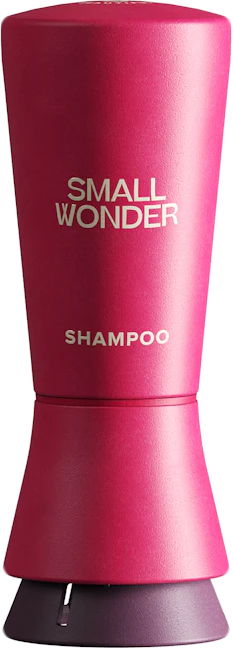 A red Small Wonder Shampoo bottle