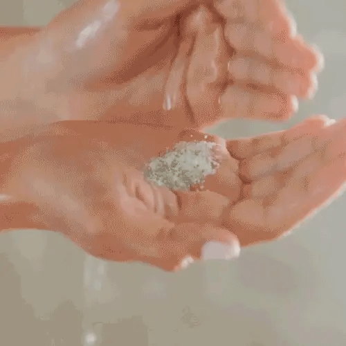 Gif of hands using powder to lather.
